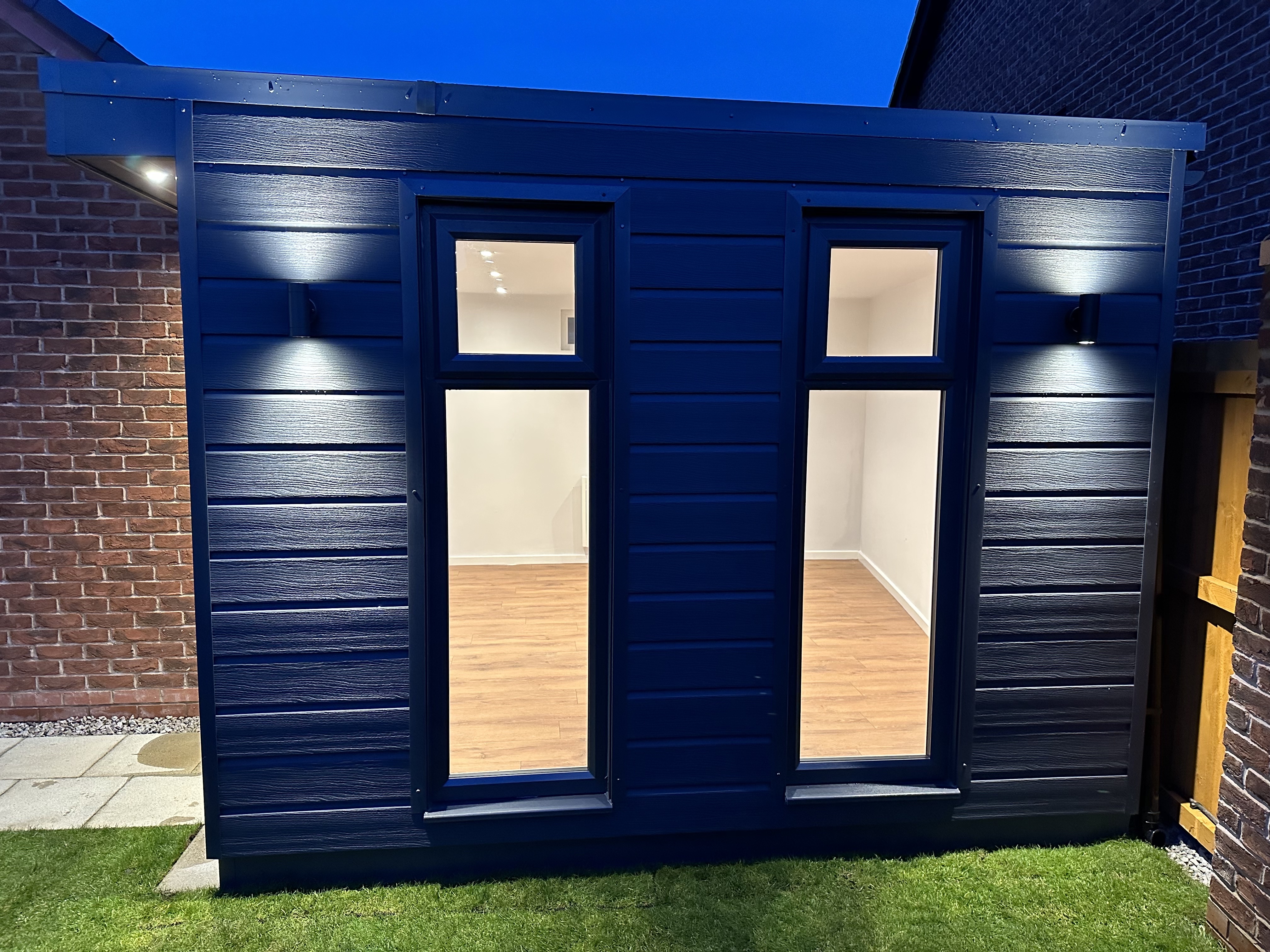 Garden room in contemporary black cladding by Lux Garden Rooms