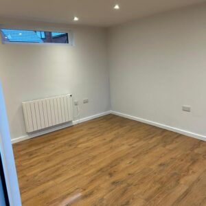 inside empty garden room with slot window