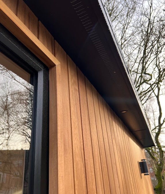 garden room office and accommodation roe green front overhang
