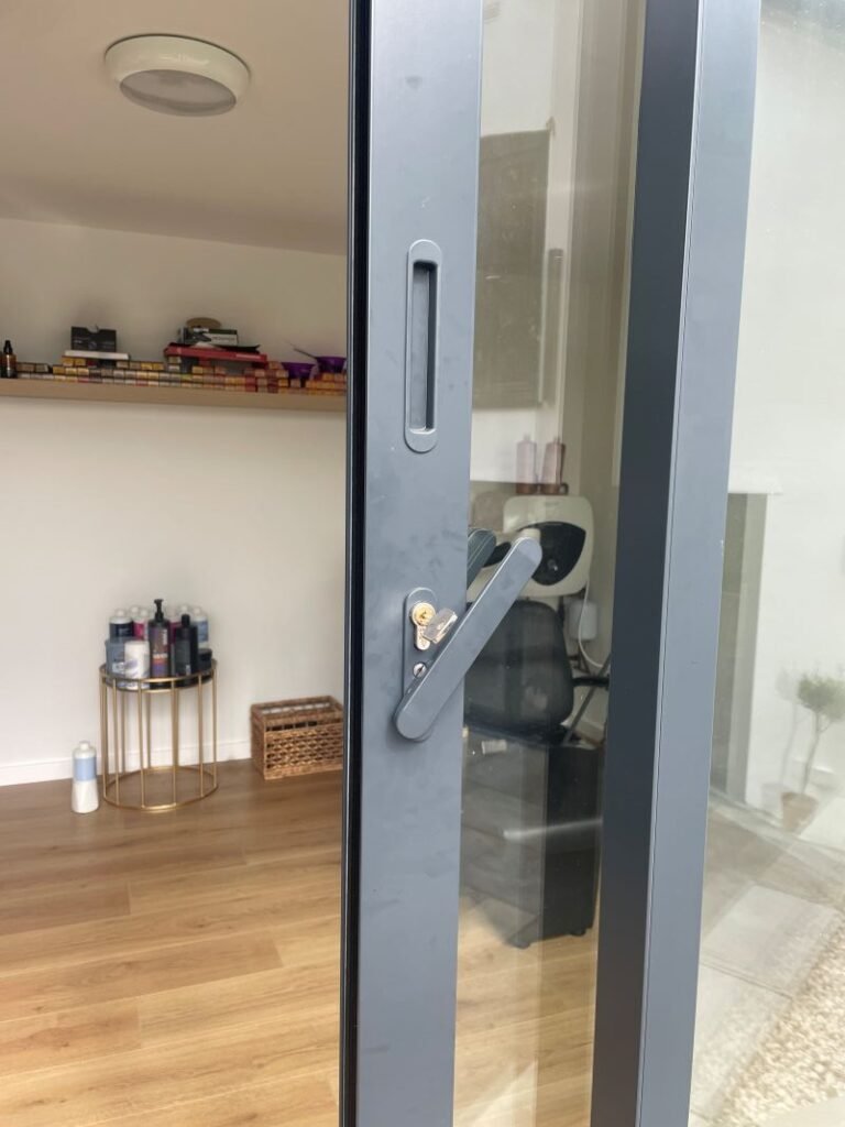 hair salon garden room warrington door lock close up with view of studio